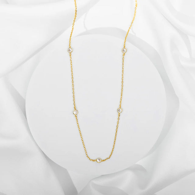 Yellow Gold Lieve Station Necklace — full necklace with five bezel-set cubic zirconia stations