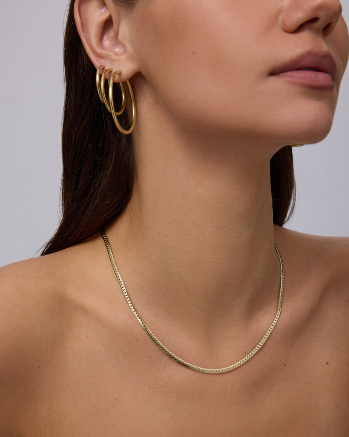 Yellow Gold Renske Curb Chain Necklace — worn at the neckline