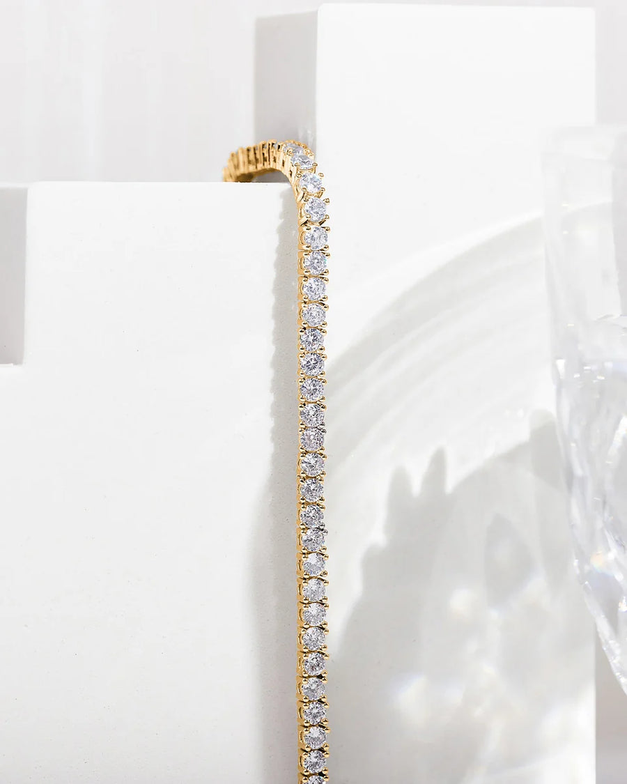 Yellow Gold Elin Tennis Bracelet — detail against a white plinth