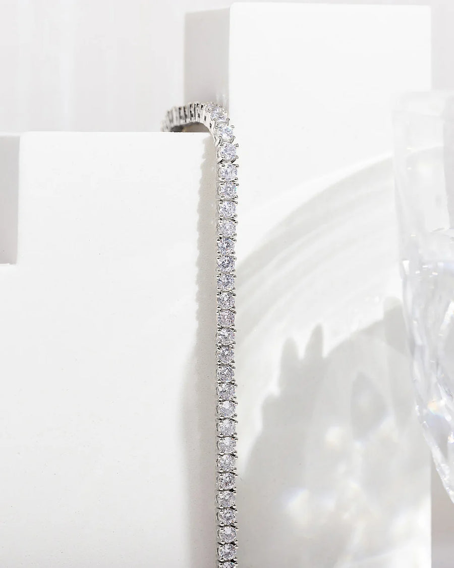 White Gold Elin Tennis Bracelet — detail against a white plinth