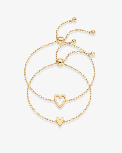 Yellow Gold Nova Heart Bolo Bracelet — pair of bolo bracelets, open heart and solid heart