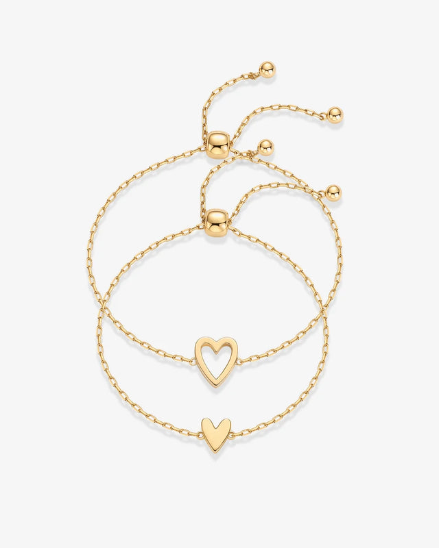 Yellow Gold Nova Heart Bolo Bracelet — pair of bolo bracelets, open heart and solid heart